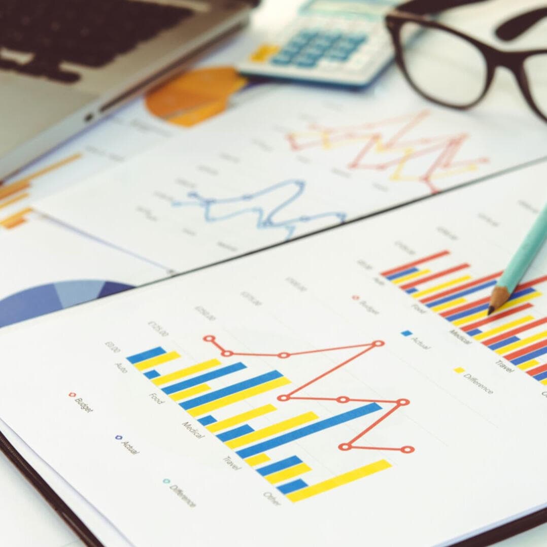 Business charts and financial data on a desk